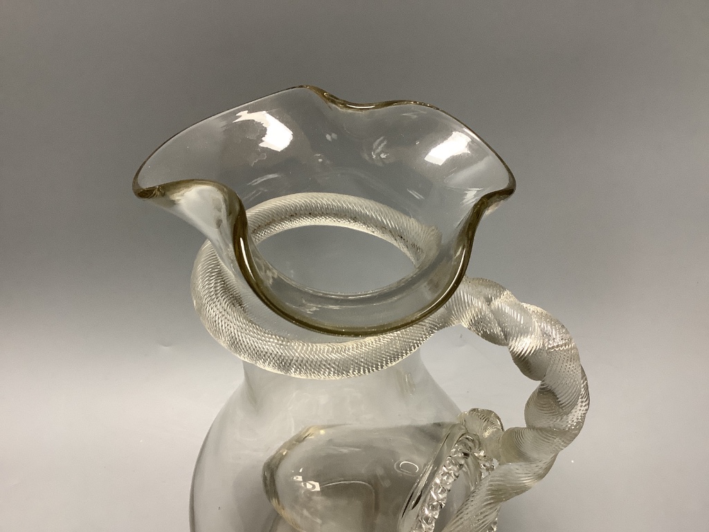 A 19th century glass lemonade jug with snake handle and ice compartment, height 33cm